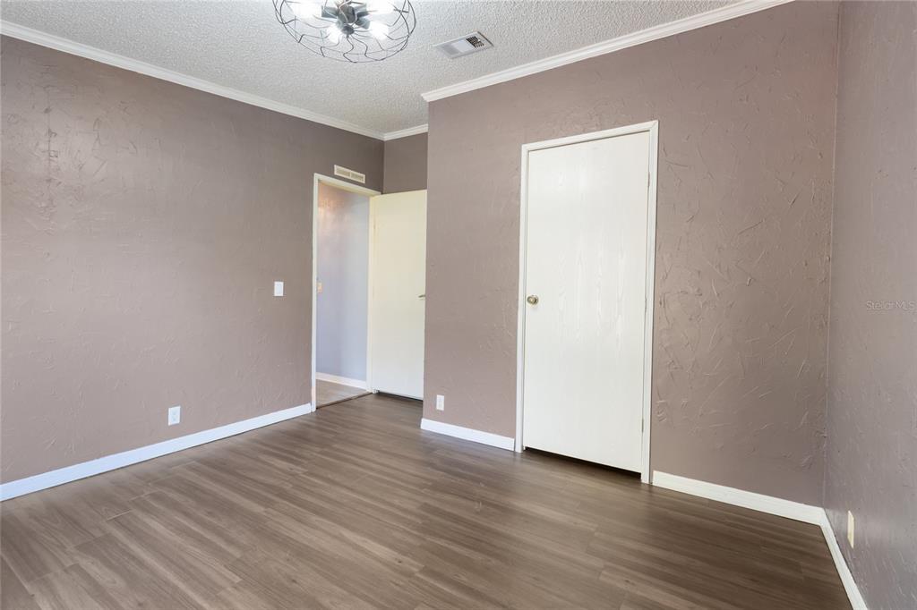 4912 Miley Road Plant City, FL 33565 - Photo 38 of 48 a view of an empty room with wooden floor