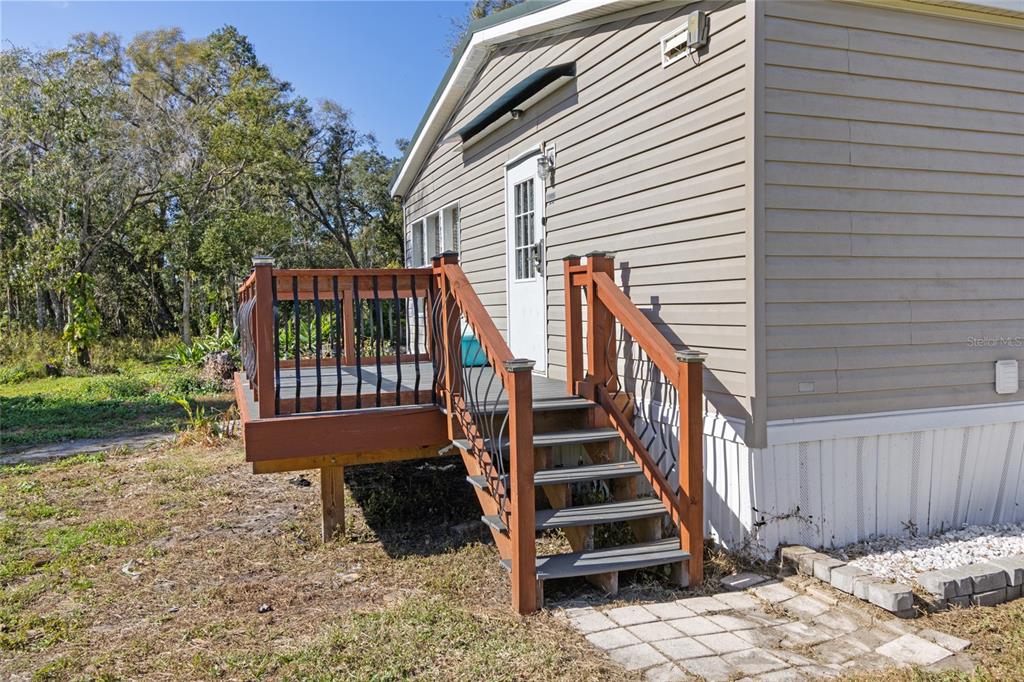 4912 Miley Road Plant City, FL 33565 - Photo 40 of 48 a view of a deck with a yard