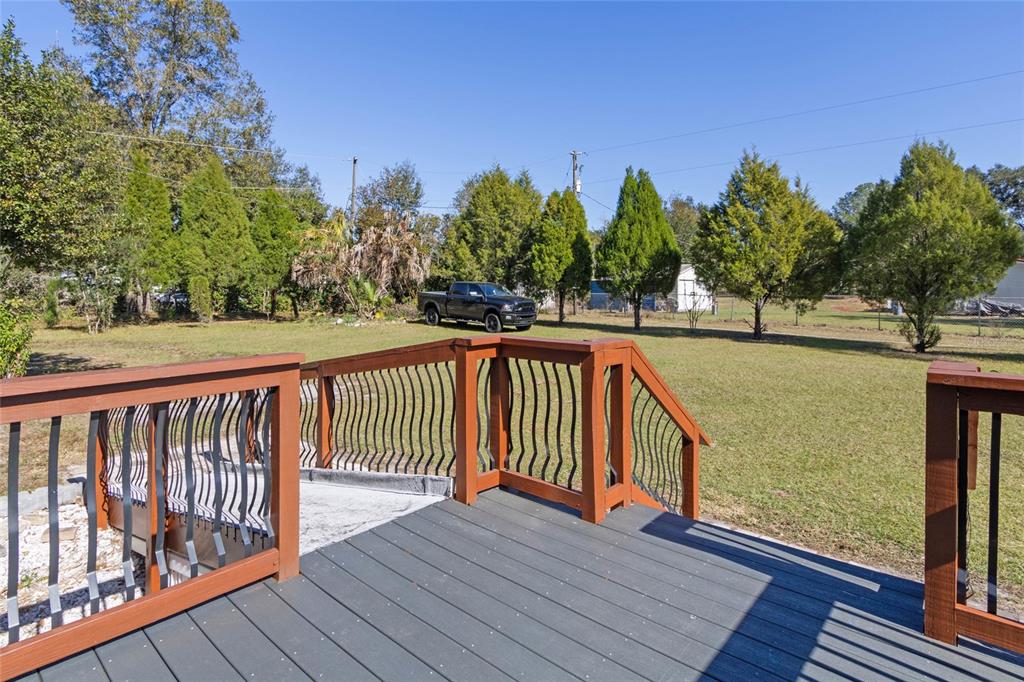 4912 Miley Road Plant City, FL 33565 - Photo 4 of 48 a view of deck and hardwood