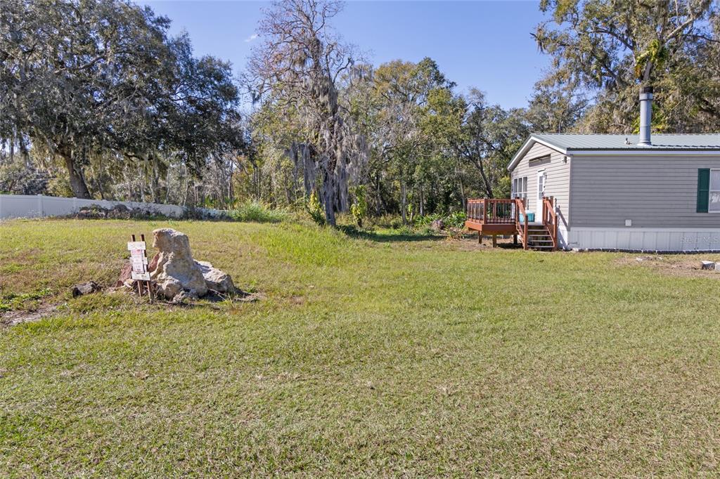 4912 Miley Road Plant City, FL 33565 - Photo 41 of 48 a view of a house with a yard and garage
