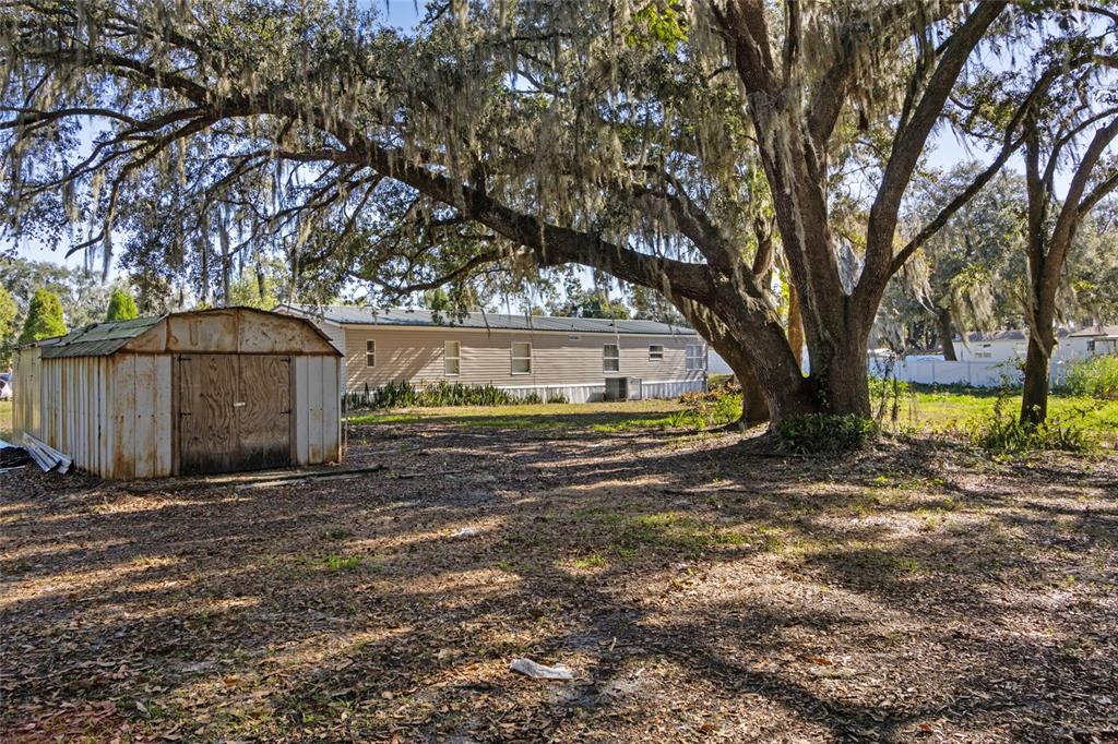 4912 Miley Road Plant City, FL 33565 - Photo 48 of 48 a view of a house with yard and tree s