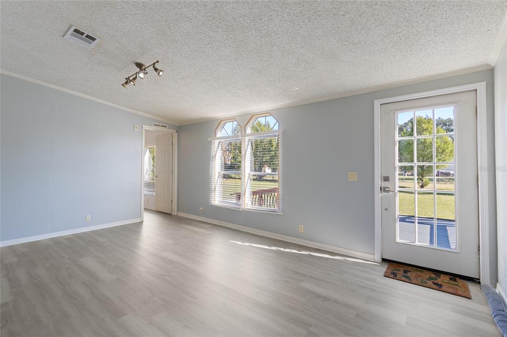 4912 Miley Road Plant City, FL 33565 - Photo 9 of 48 a view of an empty room with a window