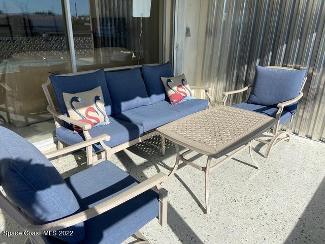 146 Bimini Road Cocoa Beach, FL 32931 - Photo 26 of 37 a view of a chairs and table in patio