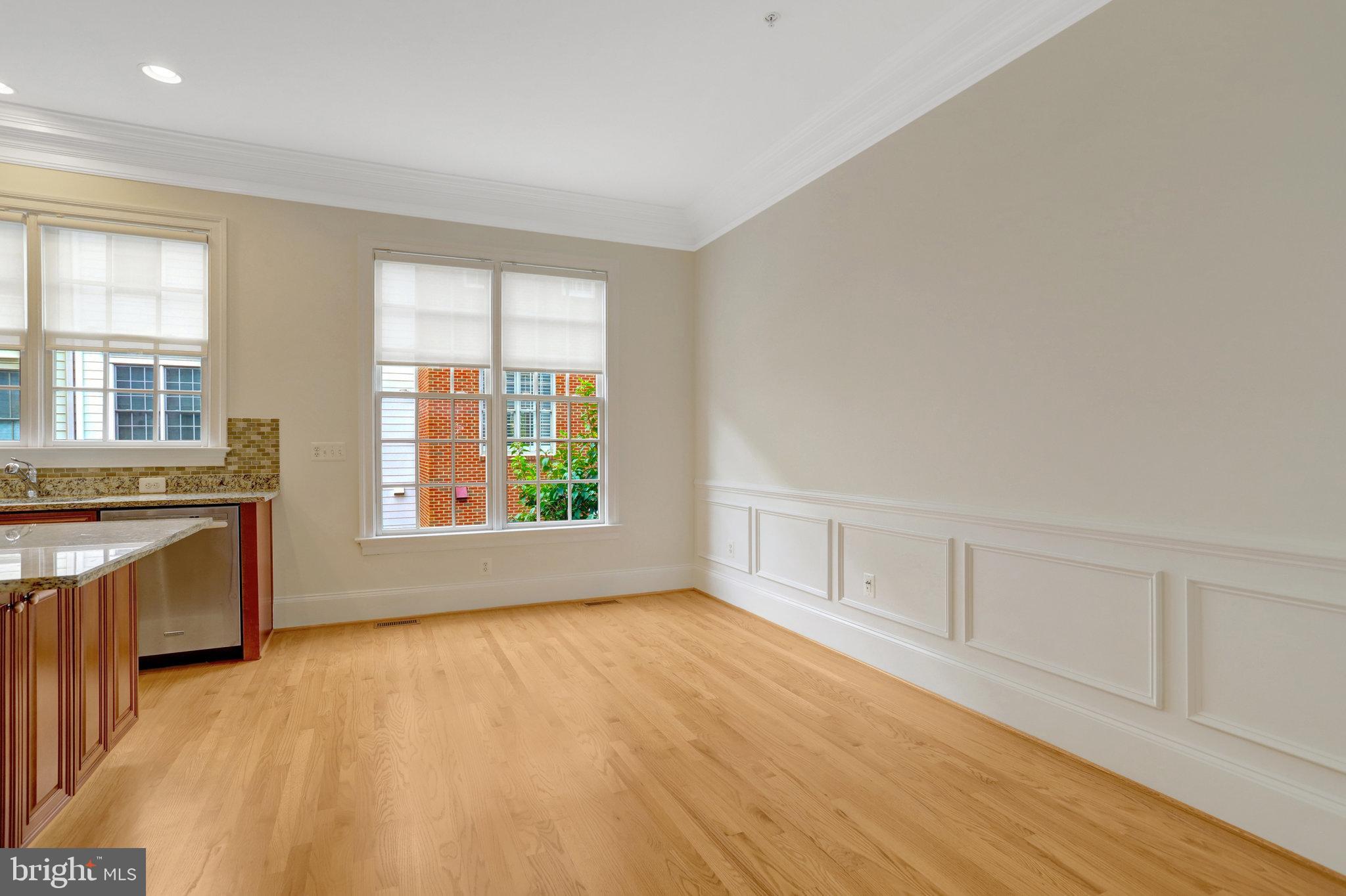 1852 Carpenter Road Alexandria, VA 22314 - Photo 13 of 63 a view of an empty room with a window and wooden floor