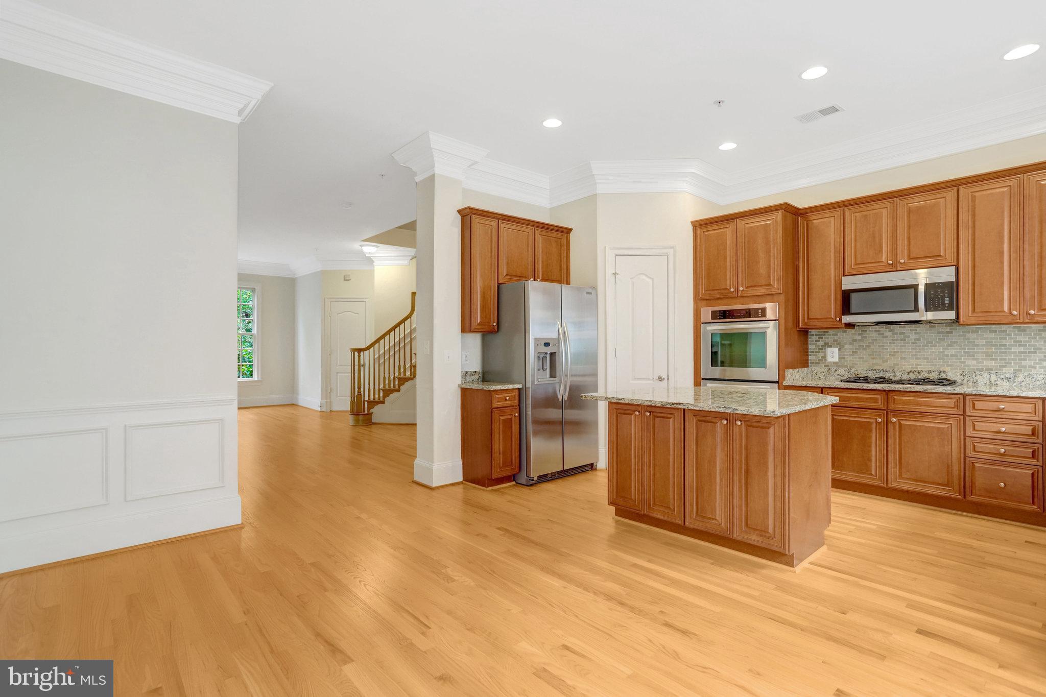 1852 Carpenter Road Alexandria, VA 22314 - Photo 14 of 63 a kitchen with stainless steel appliances granite countertop a refrigerator a stove a sink and a oven