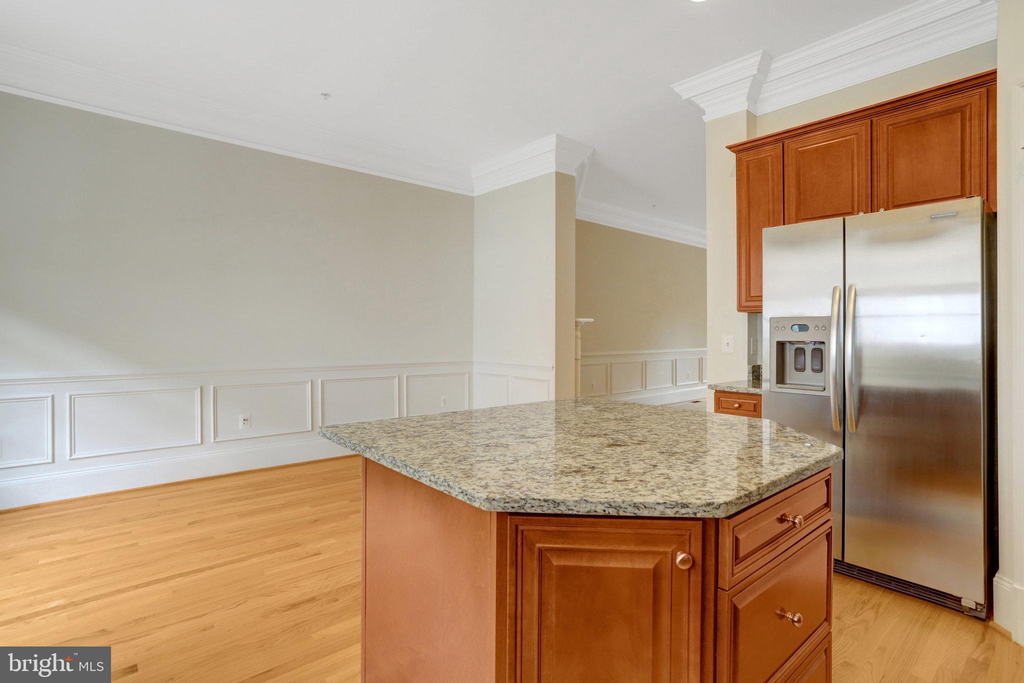 1852 Carpenter Road Alexandria, VA 22314 - Photo 18 of 63 a kitchen with stainless steel appliances granite countertop a sink and cabinets