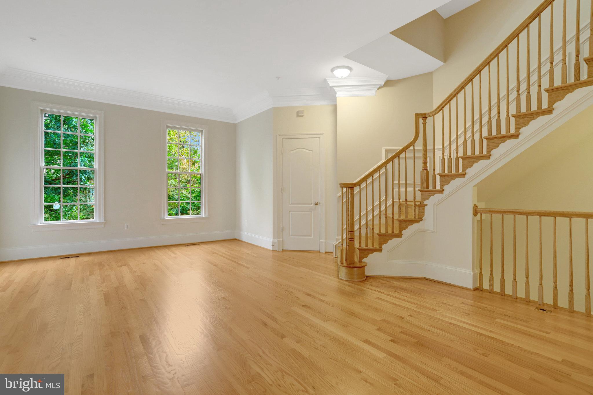 1852 Carpenter Road Alexandria, VA 22314 - Photo 22 of 63 a view of an empty room with wooden floor and a window