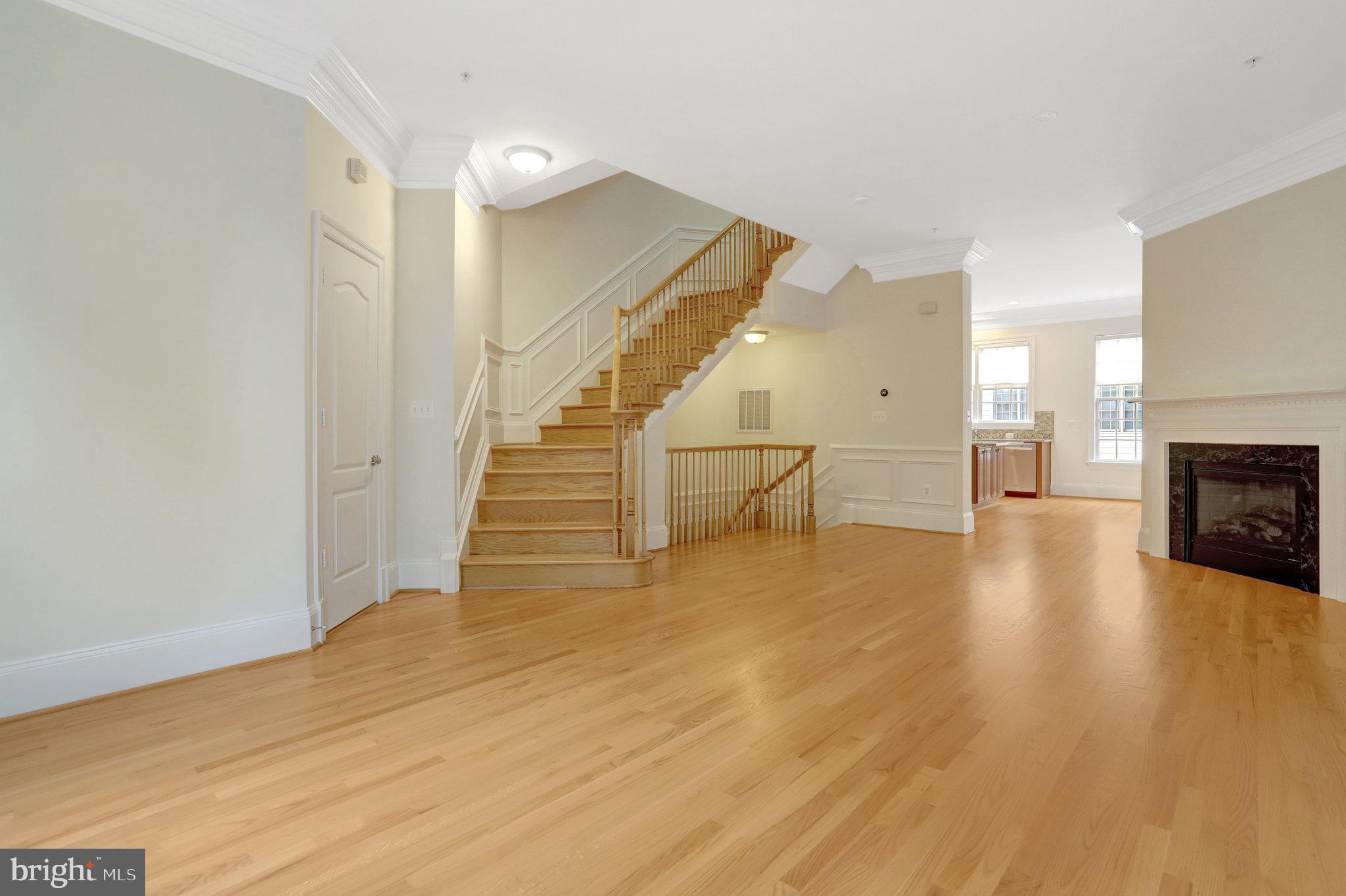1852 Carpenter Road Alexandria, VA 22314 - Photo 23 of 63 a view of empty room with wooden floor and fireplace