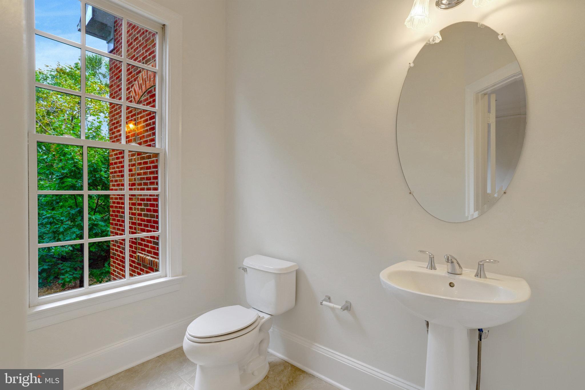1852 Carpenter Road Alexandria, VA 22314 - Photo 25 of 63 a bathroom with a sink and a mirror