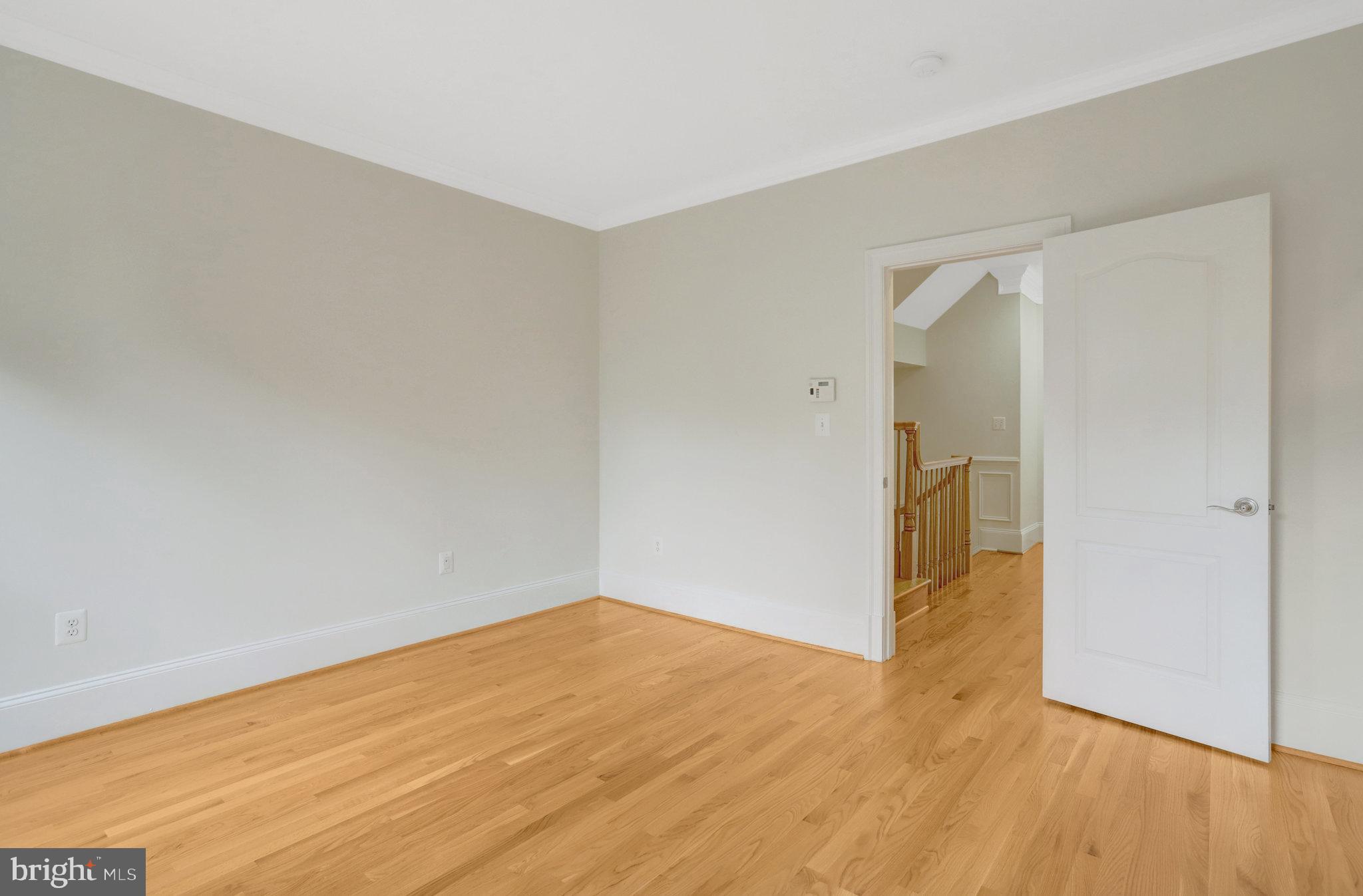 1852 Carpenter Road Alexandria, VA 22314 - Photo 32 of 63 a view of empty room with wooden floor