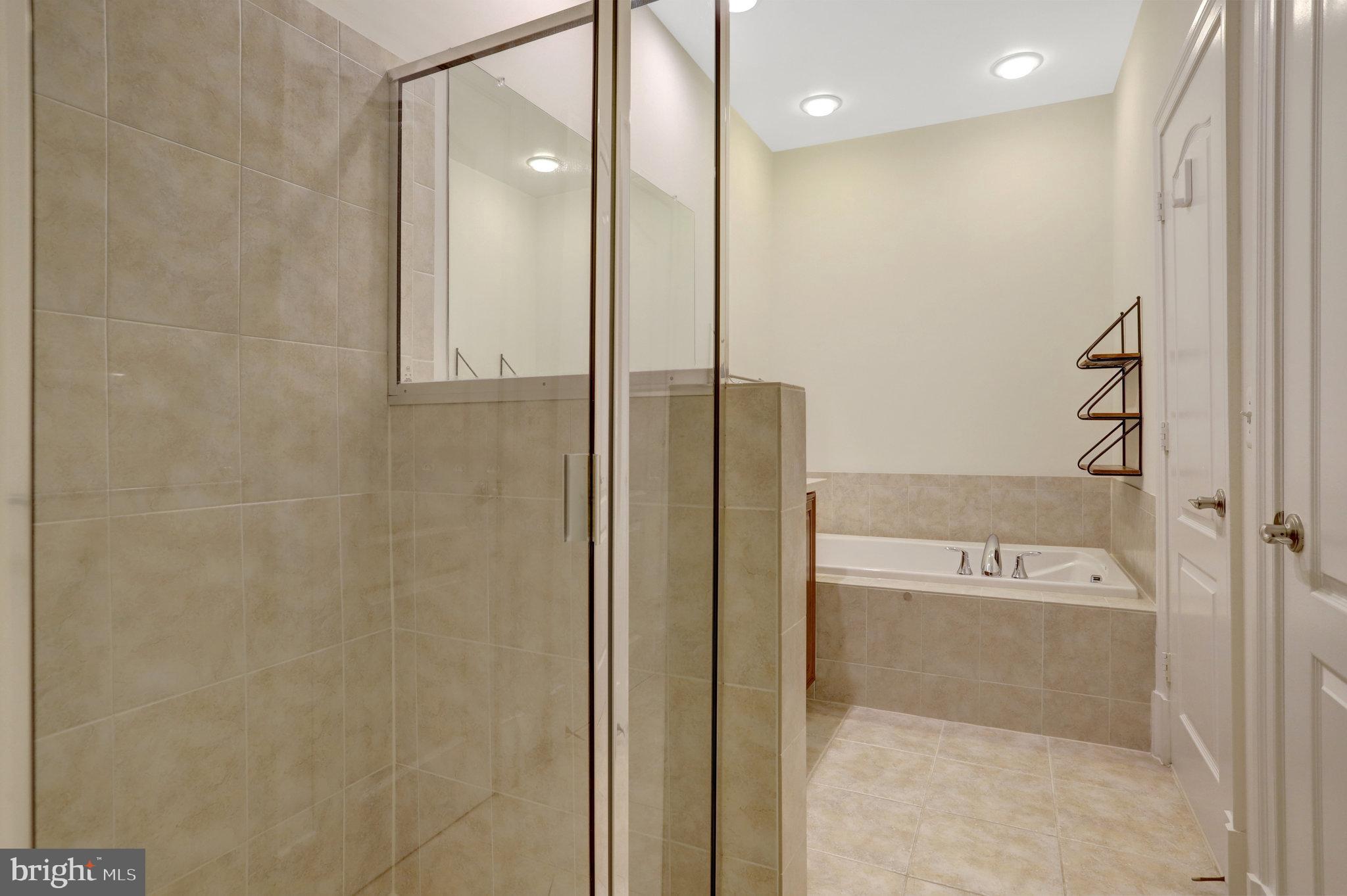 1852 Carpenter Road Alexandria, VA 22314 - Photo 36 of 63 a bathroom with a shower and a glass door