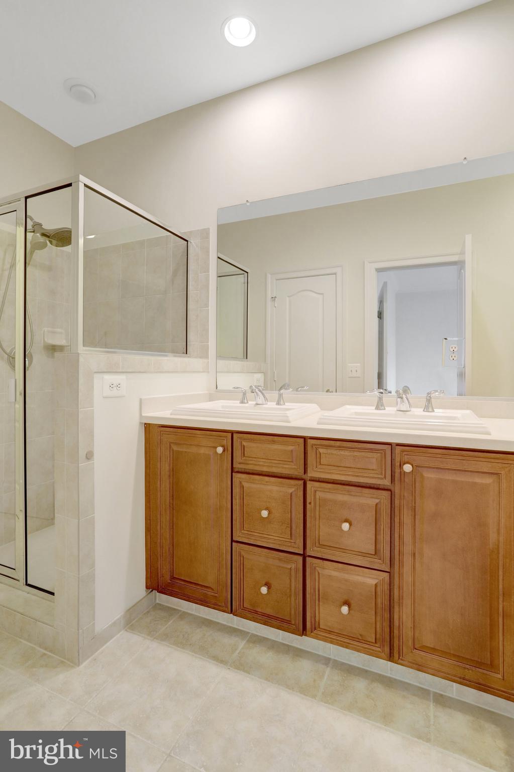 1852 Carpenter Road Alexandria, VA 22314 - Photo 38 of 63 a bathroom with a granite countertop sink mirror and
