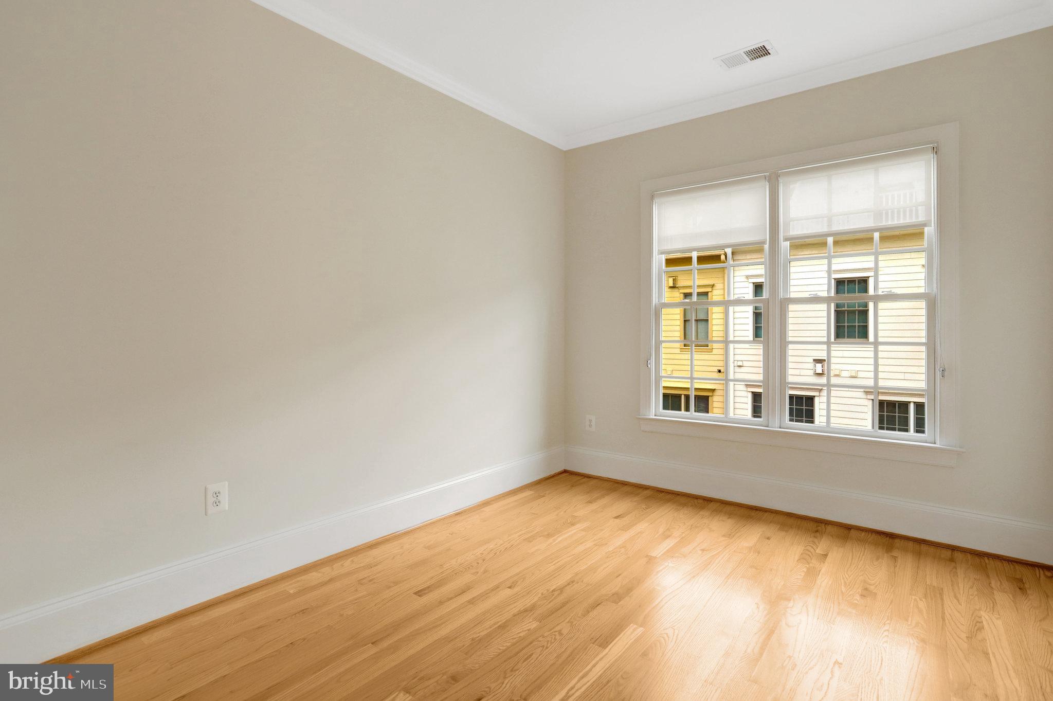 1852 Carpenter Road Alexandria, VA 22314 - Photo 44 of 63 wooden floor in an empty room with a window