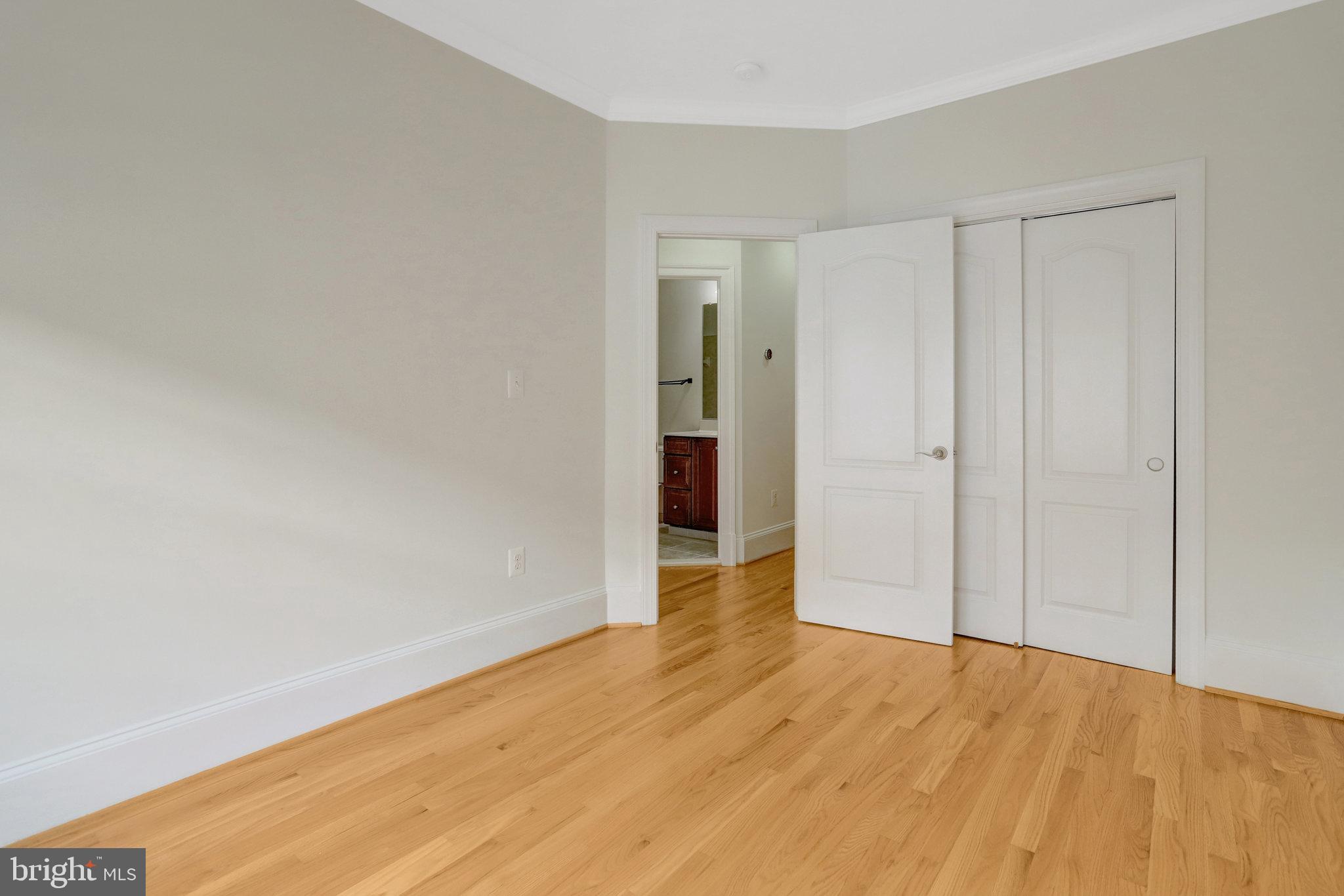 1852 Carpenter Road Alexandria, VA 22314 - Photo 46 of 63 a view of an empty room with wooden floor