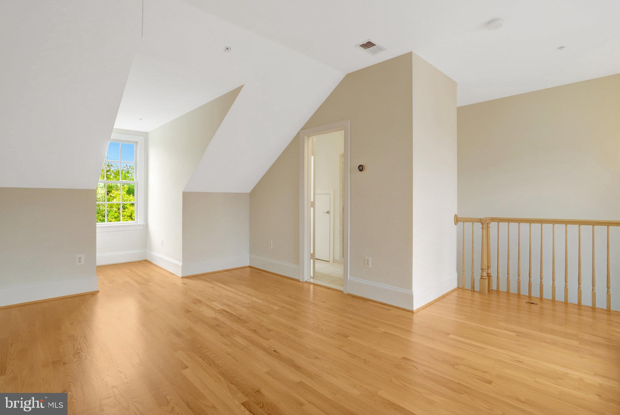 1852 Carpenter Road Alexandria, VA 22314 - Photo 51 of 63 a view of an empty room with wooden floor and a window
