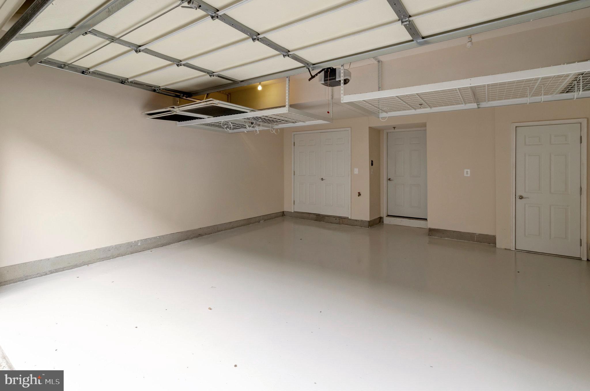 1852 Carpenter Road Alexandria, VA 22314 - Photo 59 of 63 a view of a room with a air conditioner and a ceiling fan