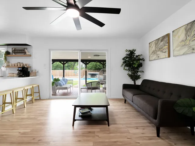 a living room with furniture and a large window