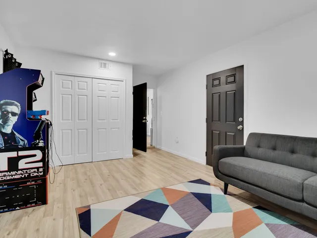 a living room with furniture and a rug