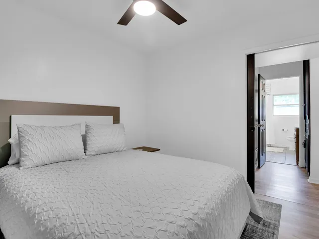 a bedroom with a bed and a walk in closet