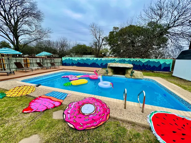 a view of swimming pool outdoor seating on both side