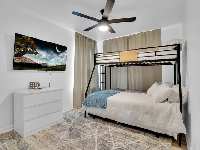 a bedroom with a bed and a walk in closet