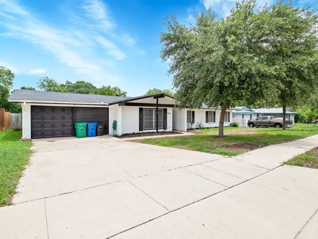 front view of a house with a yard