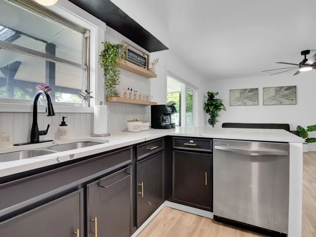 a kitchen with a sink and cabinets