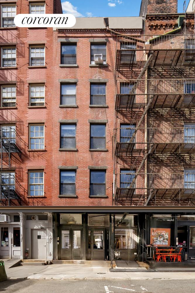 183 Duane Street Manhattan, NY 10013 - Photo 1 of 19 a front view of a building with a street