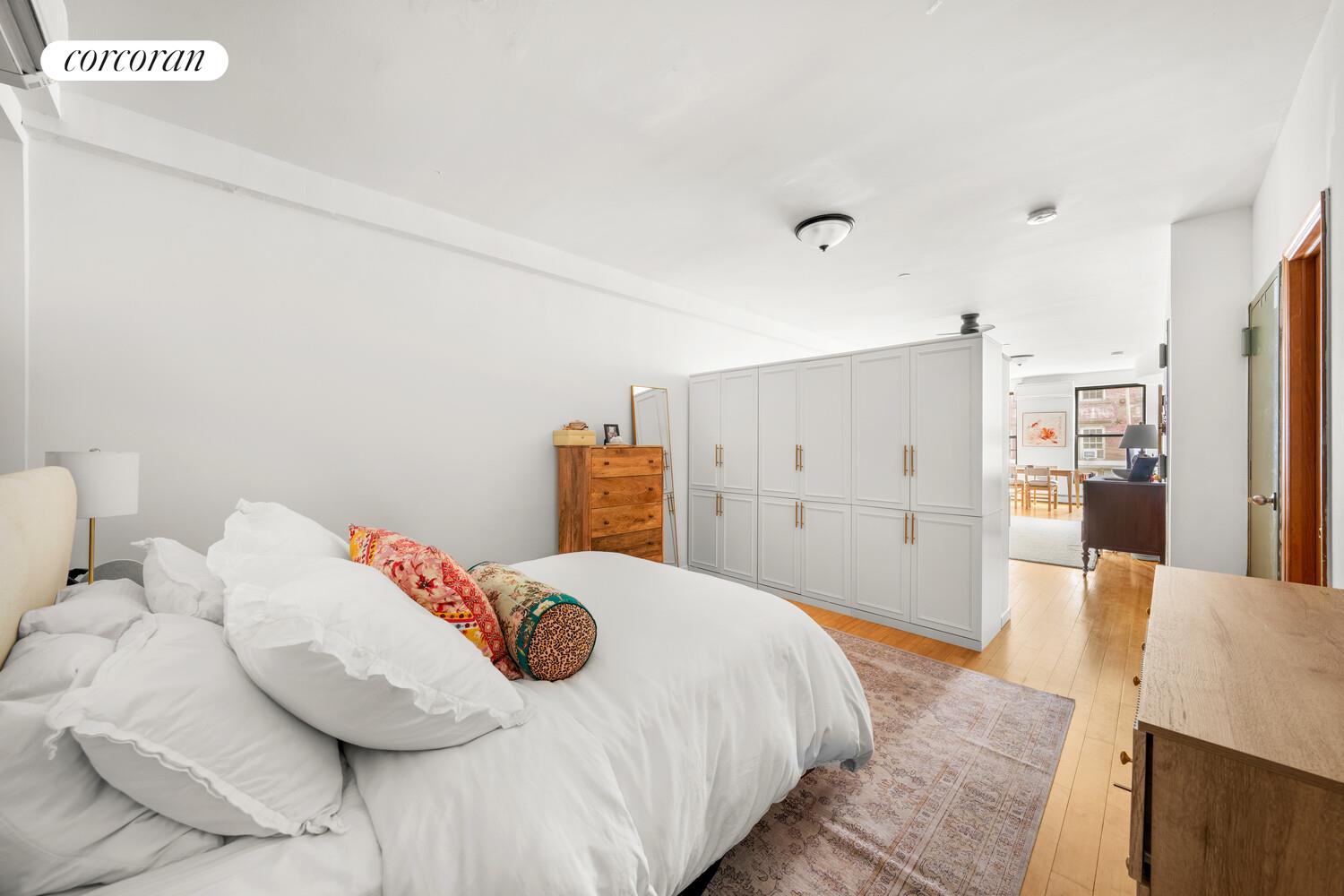 183 Duane Street Manhattan, NY 10013 - Photo 10 of 19 a bedroom with a bed and a view of kitchen