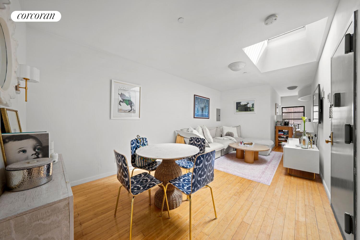 183 Duane Street Manhattan, NY 10013 - Photo 12 of 19 a living room with furniture and wooden floor