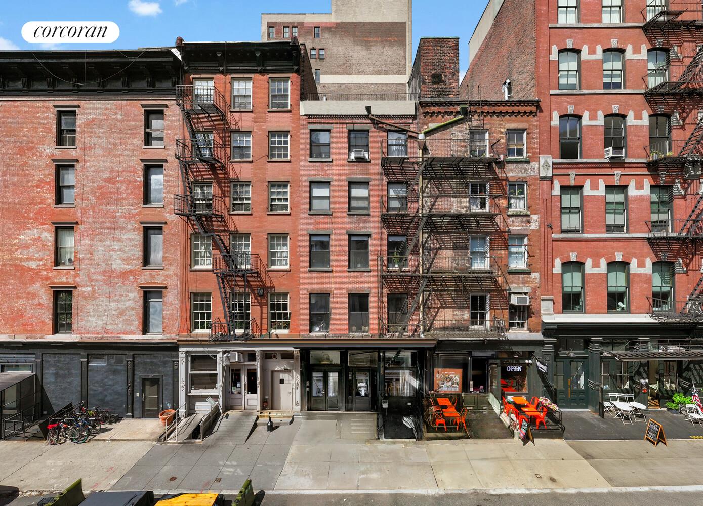 183 Duane Street Manhattan, NY 10013 - Photo 15 of 19 a view of building with door