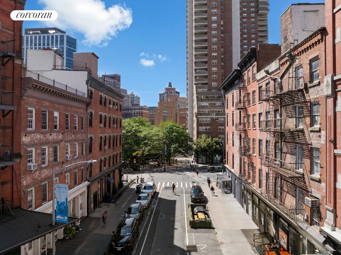 183 Duane Street Manhattan, NY 10013 - Photo 16 of 19 a view of buildings with cars