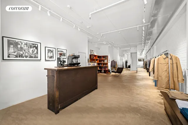 a black white and white photo of a living room
