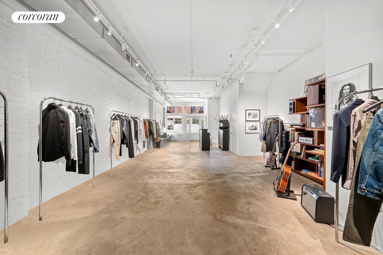 183 Duane Street Manhattan, NY 10013 - Photo 3 of 19 a view of a room with lots of gym equipment