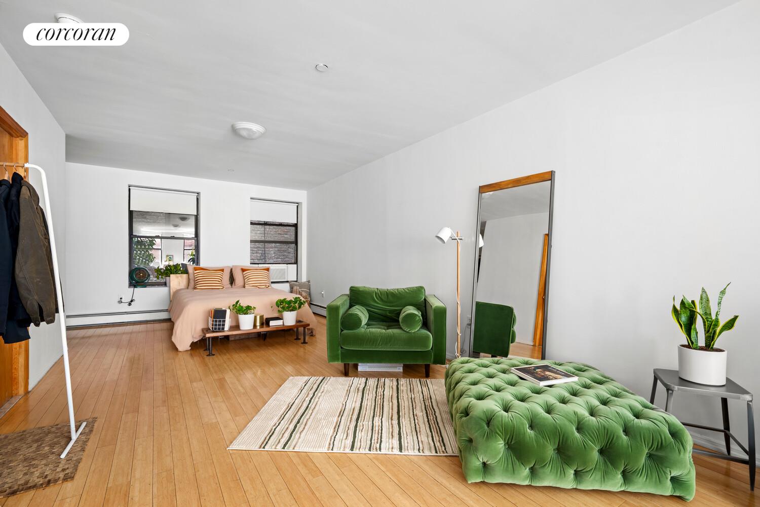 183 Duane Street Manhattan, NY 10013 - Photo 5 of 19 a bedroom with a bed and a couch