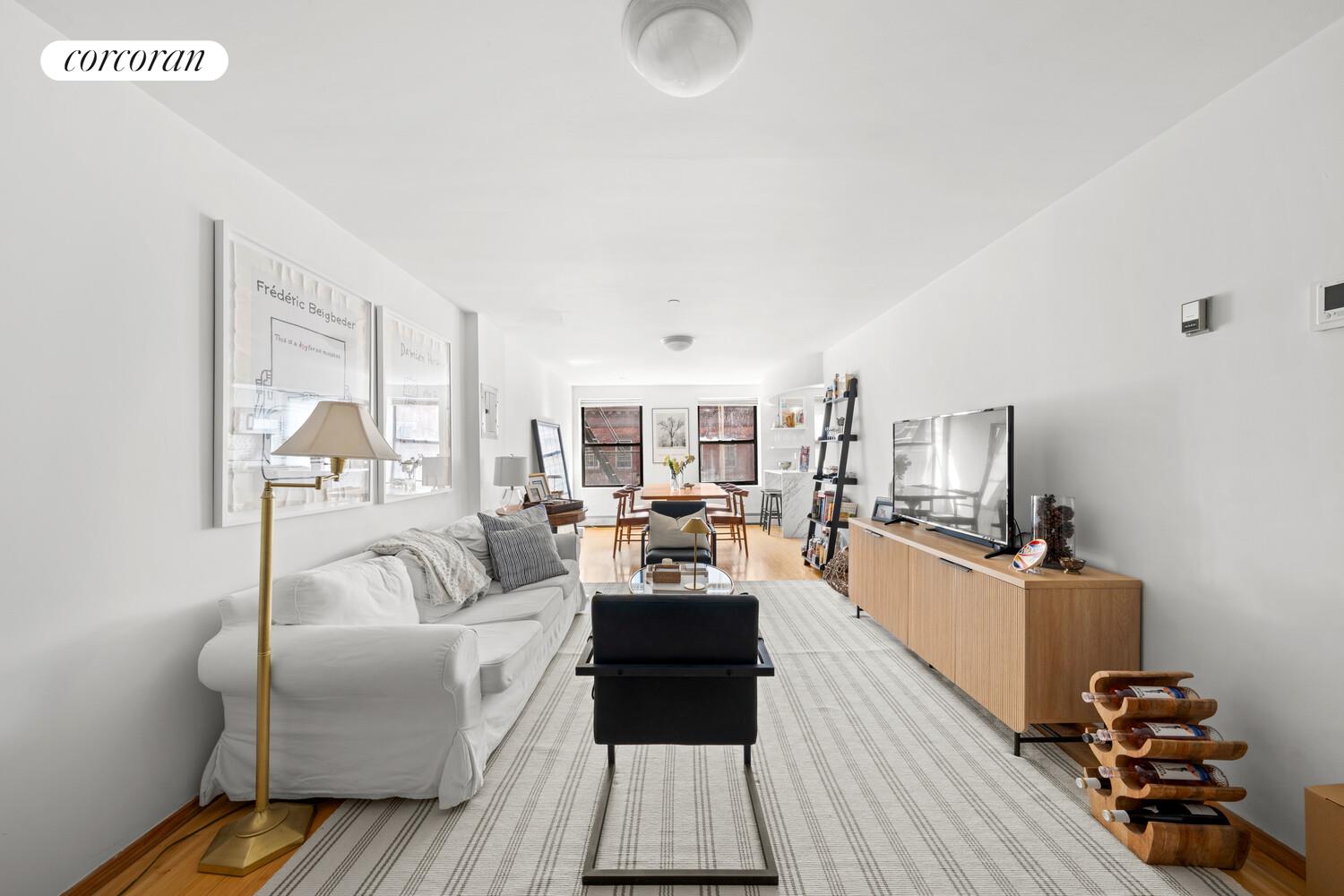 183 Duane Street Manhattan, NY 10013 - Photo 9 of 19 a living room with furniture and wooden floor