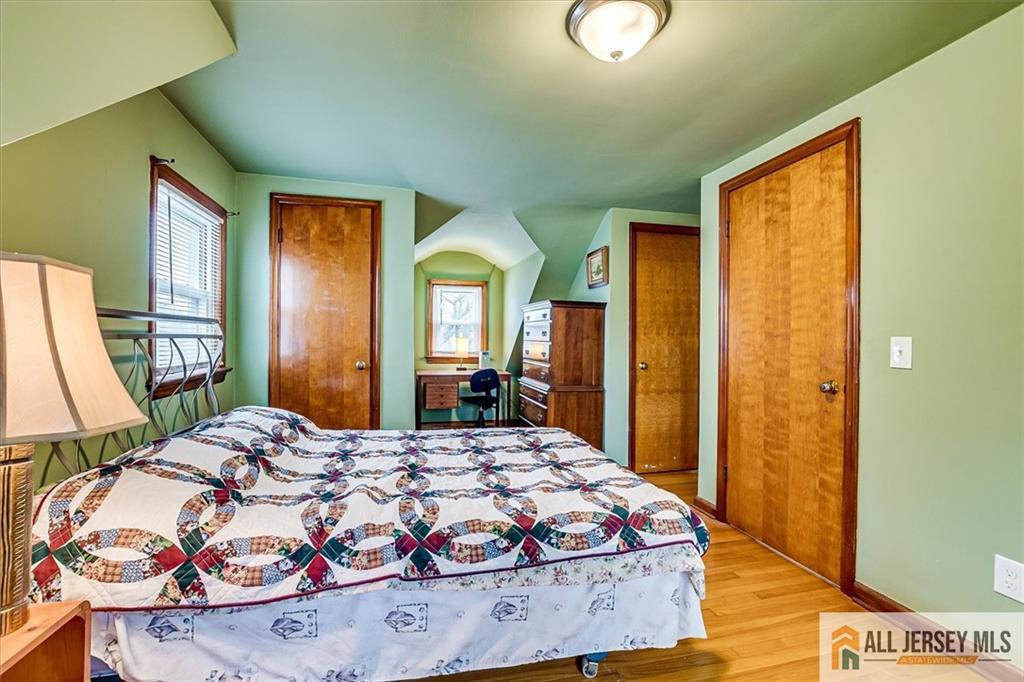 65 Colonial Drive Clark, NJ 07066 - Photo 28 of 44 a bedroom with a bed and a dresser next to a window