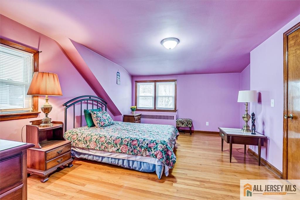 65 Colonial Drive Clark, NJ 07066 - Photo 32 of 44 a bedroom with furniture and a window