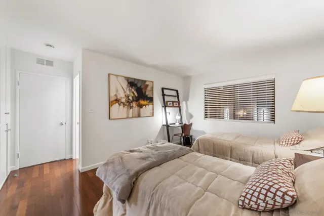 a bedroom with a bed and a couch