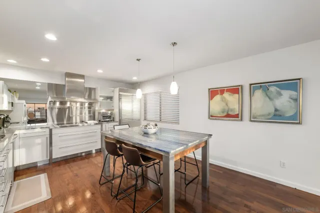 a kitchen with a table and chairs in it
