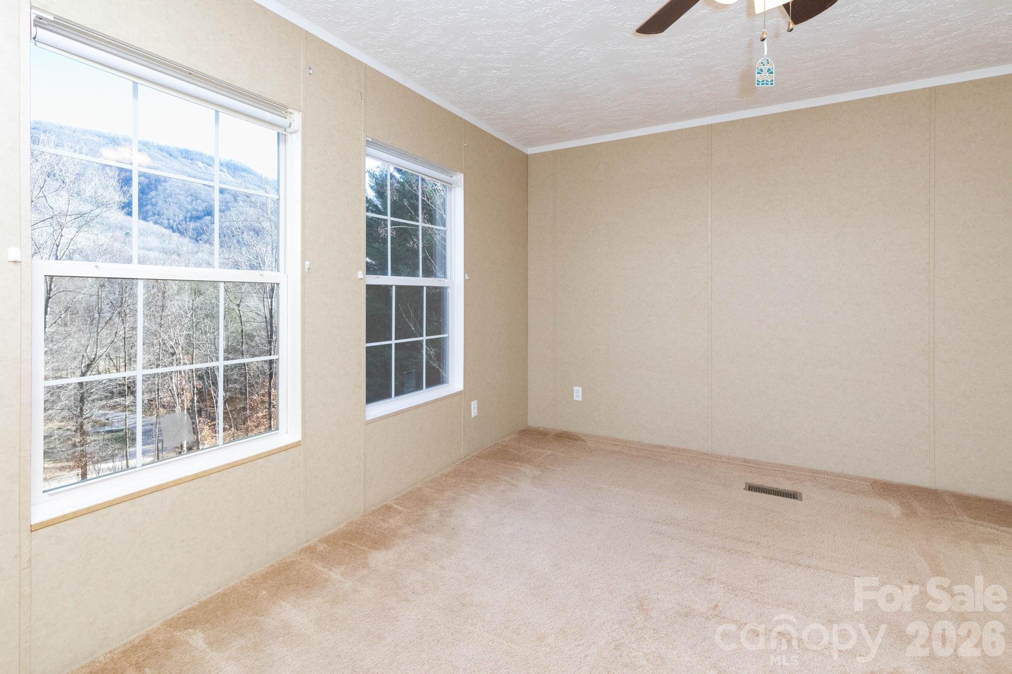 87 Hickory Nut Trace Old Fort, NC 28762 - Photo 3 of 26 a view of an empty room with a window