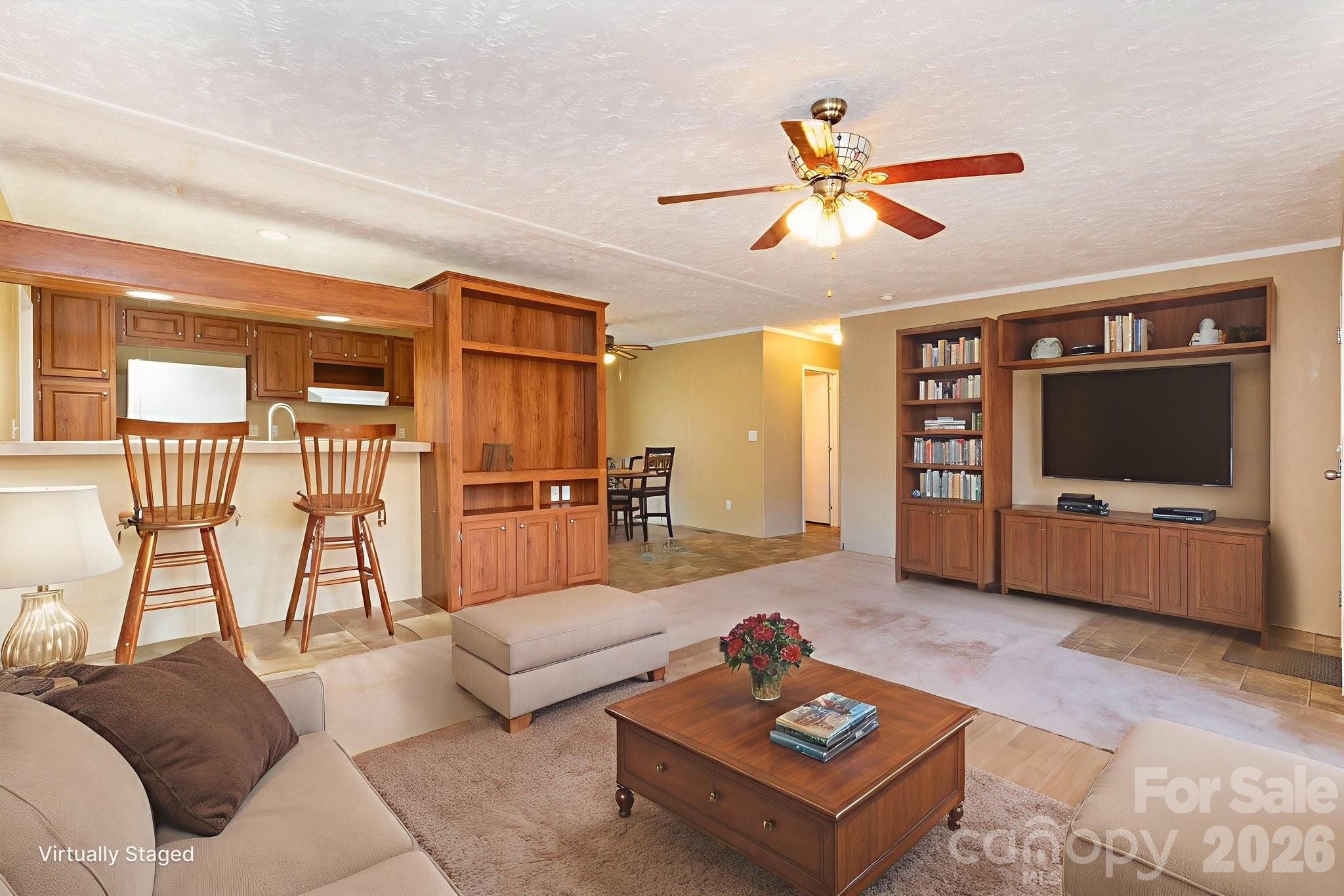 87 Hickory Nut Trace Old Fort, NC 28762 - Photo 4 of 26 a living room with furniture a flat screen tv and a large window