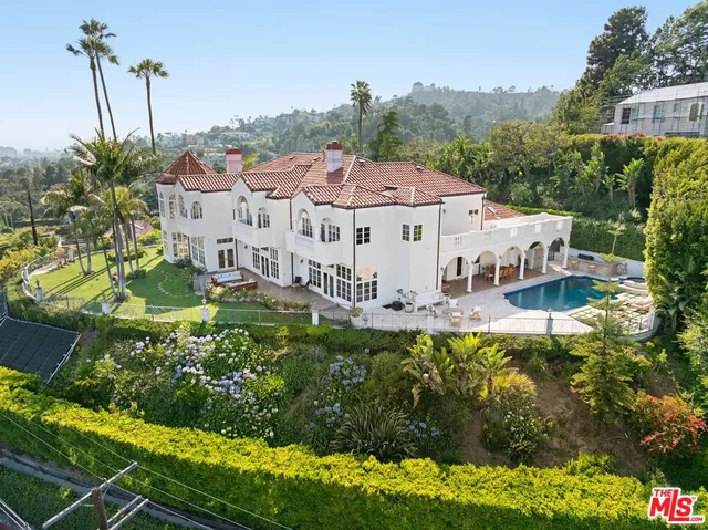 a aerial view of a house with a yard
