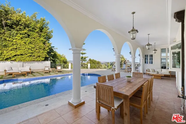 a view of swimming pool with a lounge chair