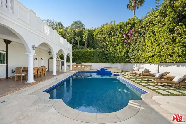 a view of a chairs and table in a patio
