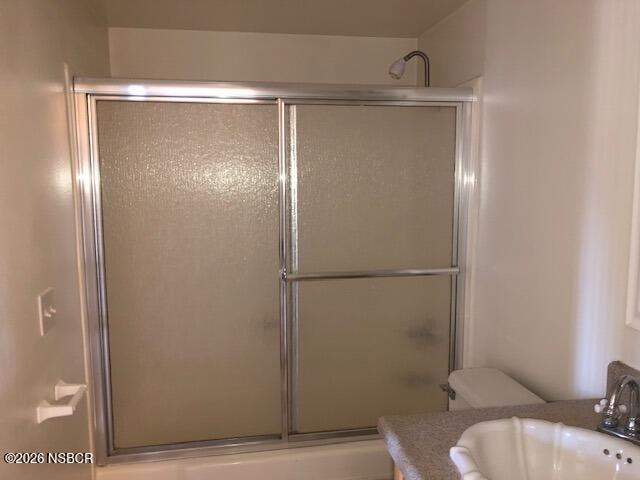 208 North R Street Lompoc, CA 93436 - Photo 14 of 22 a bathroom with a glass shower door
