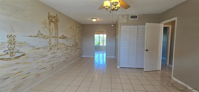 a large kitchen with granite countertop a stove a sink and a microwave