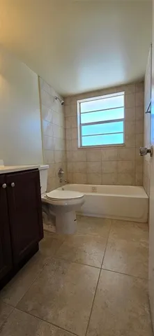 a bathroom with a sink a toilet and bathtub