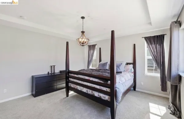 a view of hall way with furniture and window
