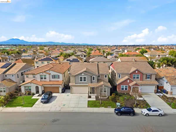 a view of multiple houses with a city street